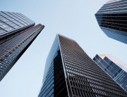 UK, London, low angle view of city financial district skyline illuminated at sunset